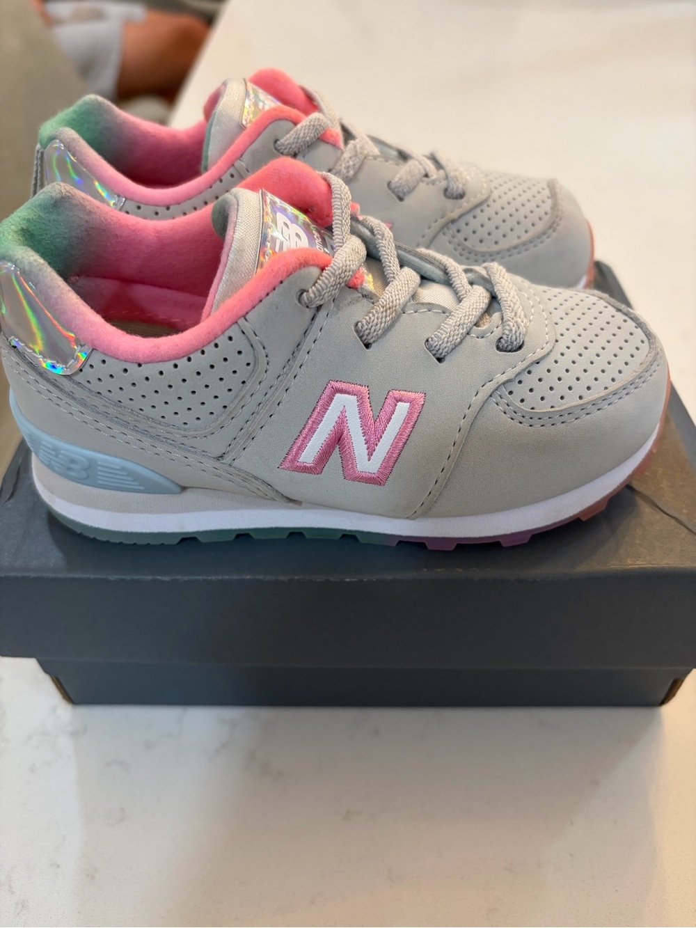 New Balance Kids Light Gray & Pink Holographic Accent Sneakers